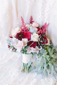 Bright and organic wedding bouquet with pink and red flowers