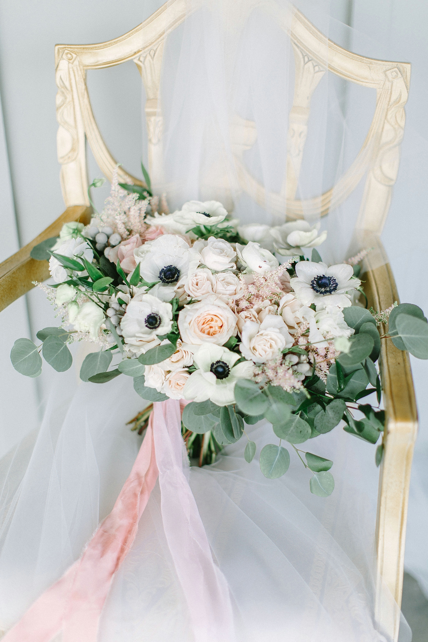 Pale pink and white wedding bouquet with anemones