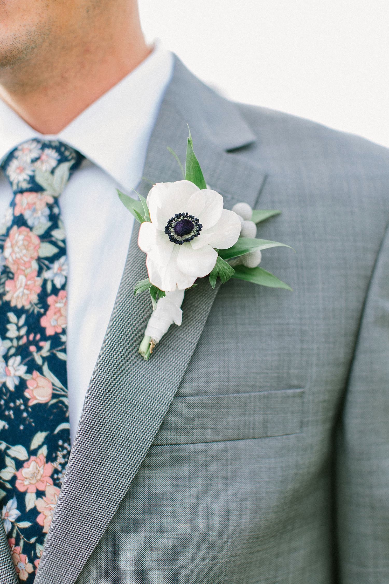Anemone Boutonniere on a gray suit